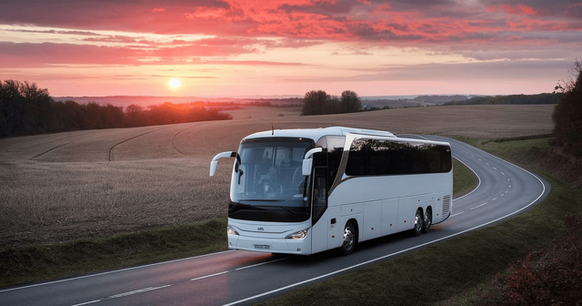 white-bus-is-driving-down-road-with-sun-setting-background.png